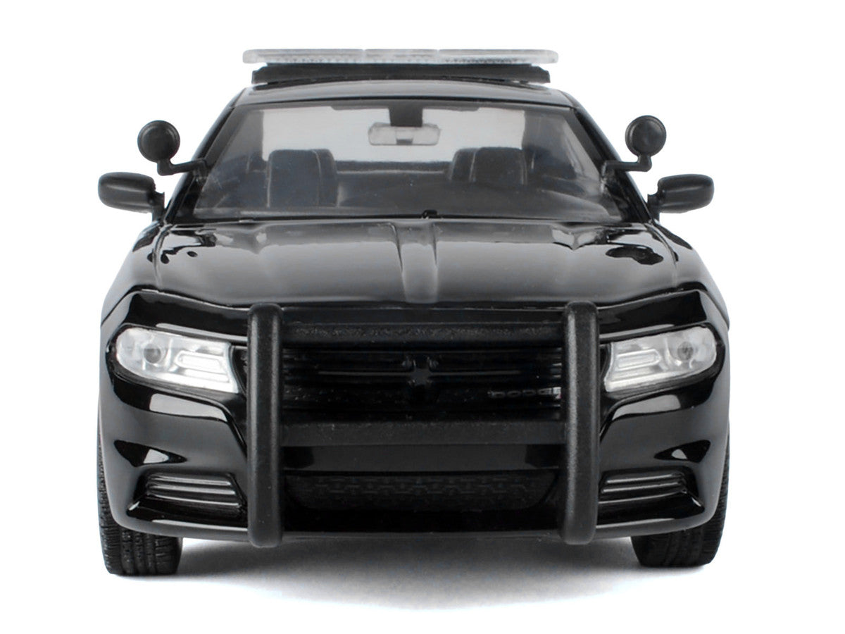Side profile of 2023 Dodge Charger Police Diecast Model in black and white