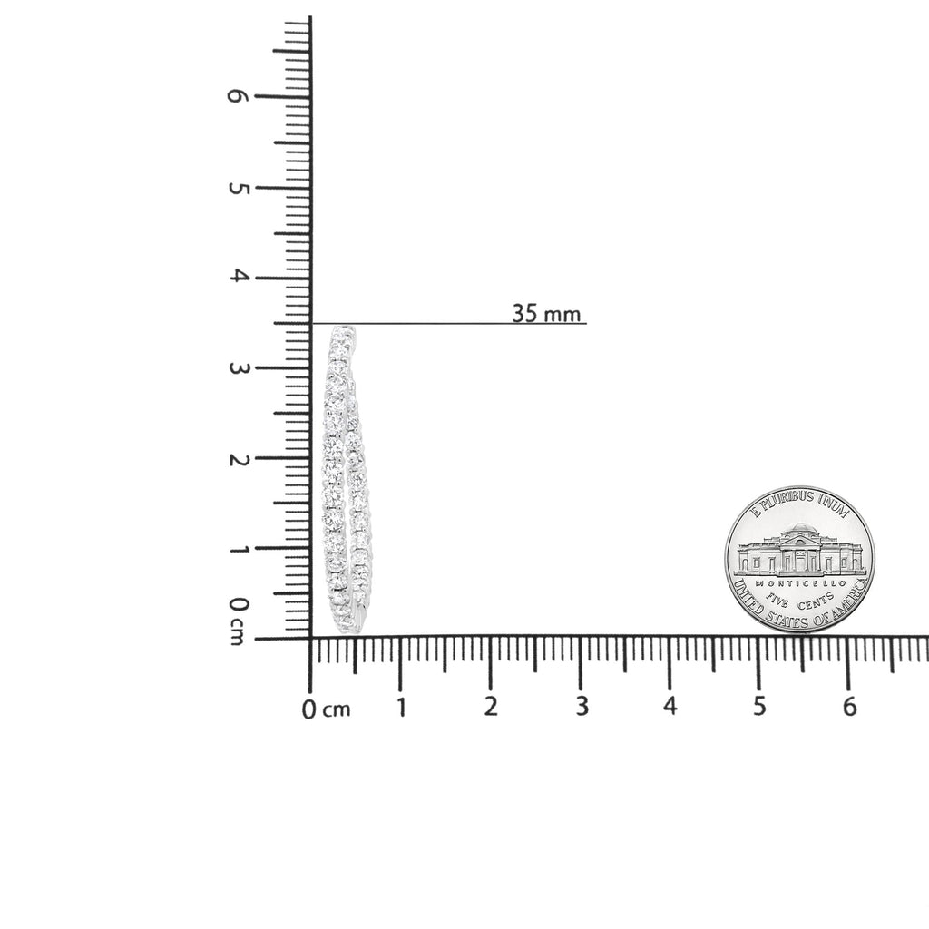 Model wearing 18K White Gold Diamond Hoop Earrings at an event