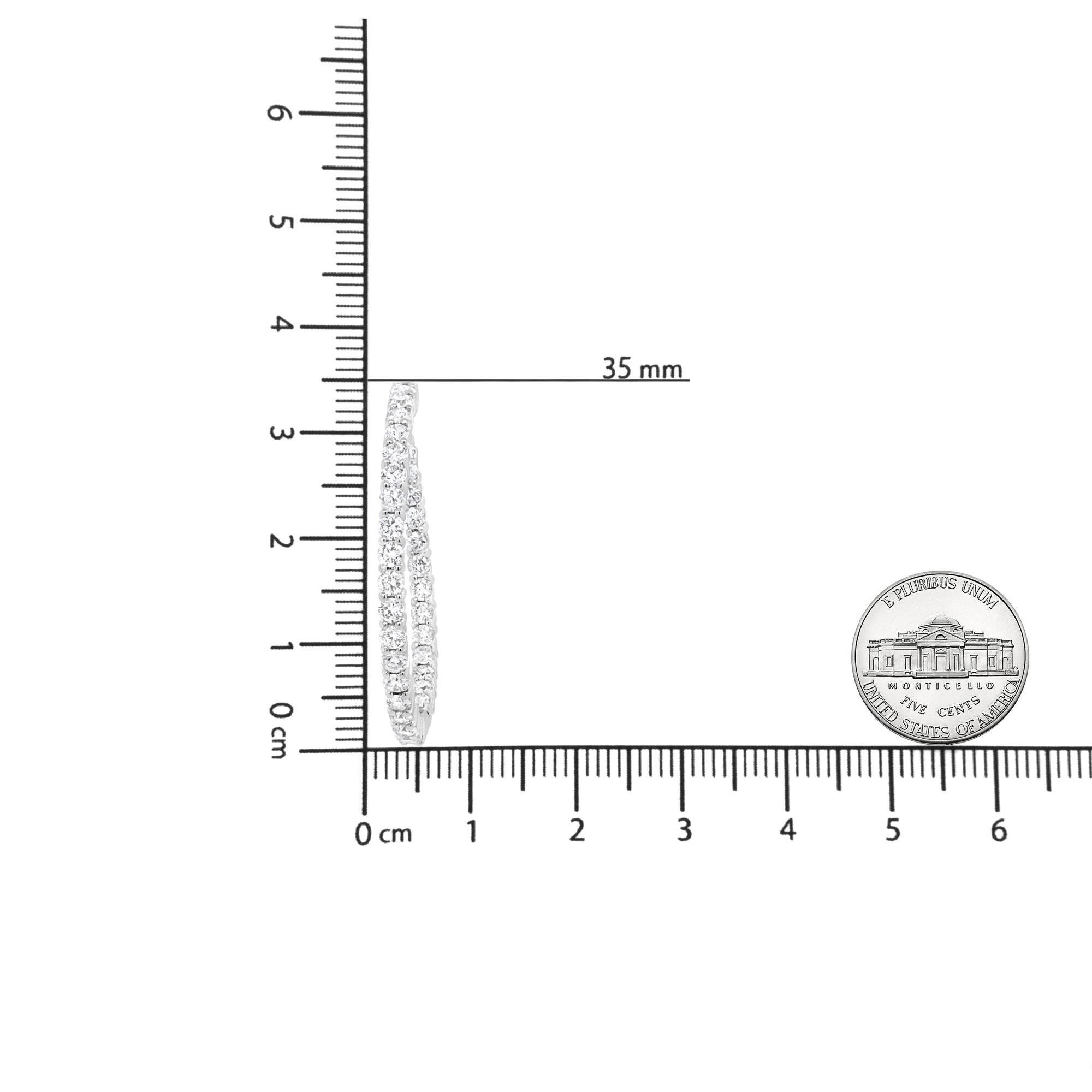 Model wearing 18K White Gold Diamond Hoop Earrings at an event