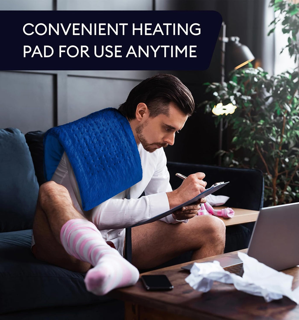 Lifestyle image of Extra Large Space Blue Heating Pad in use on a couch