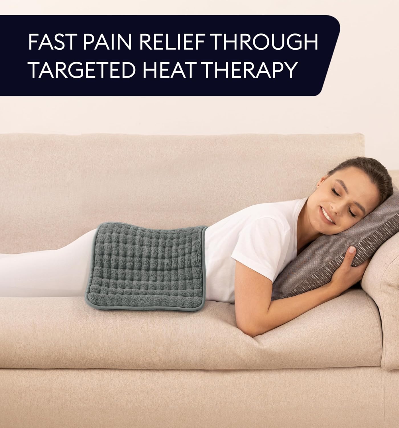 Lifestyle image of Geniani Extra Large Heating Pad in use on a sofa