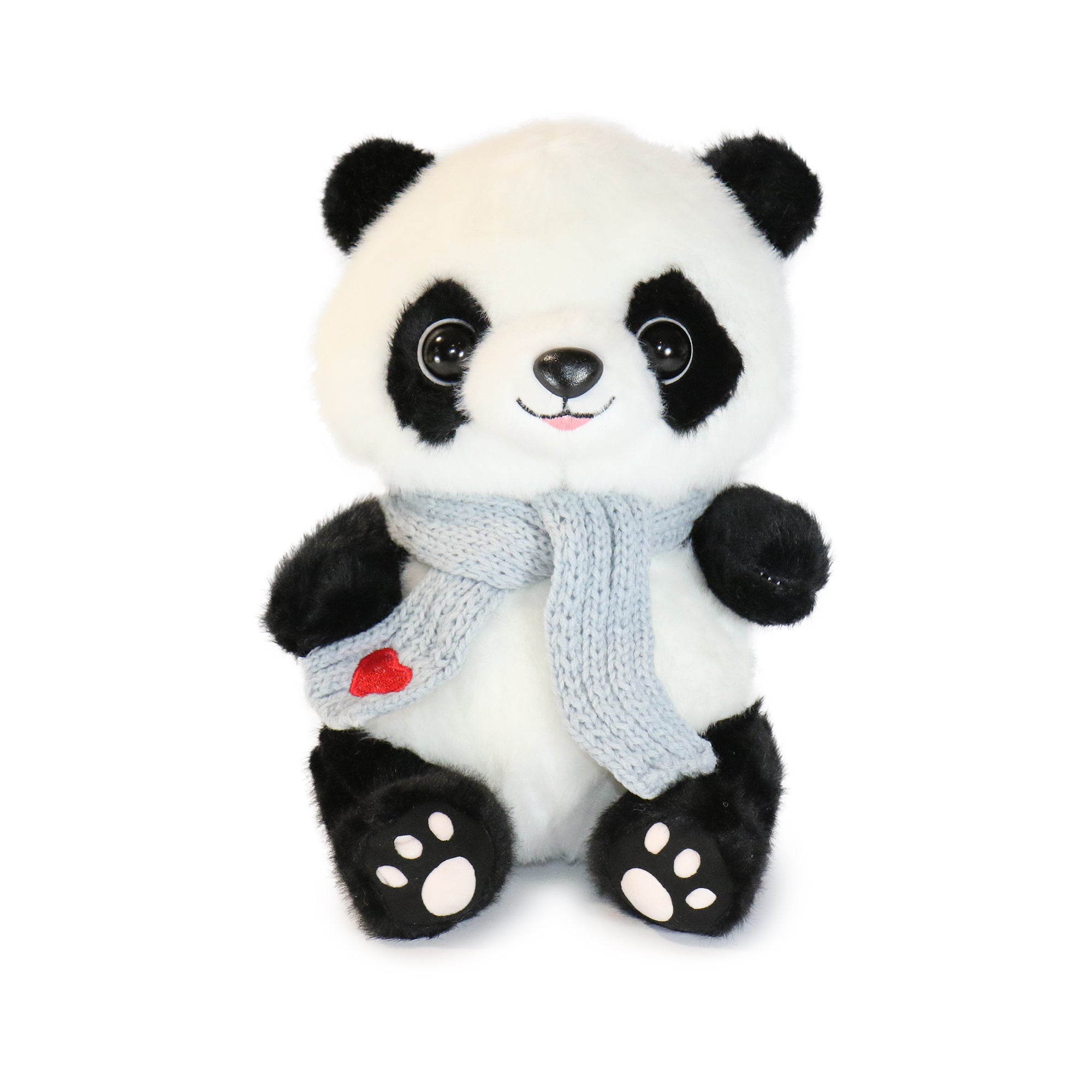 Blush Panda Plush Toy snuggling with a child on a cozy couch