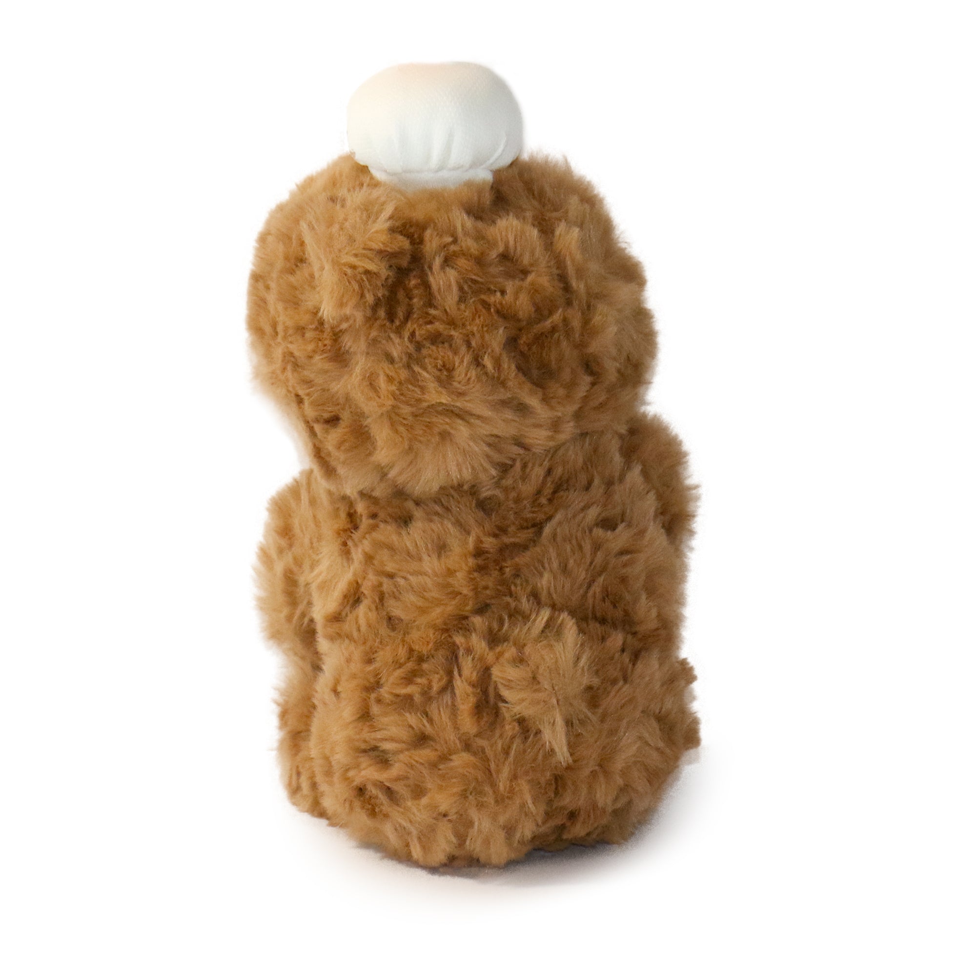 Baker Bear plush toy sitting on a kitchen countertop