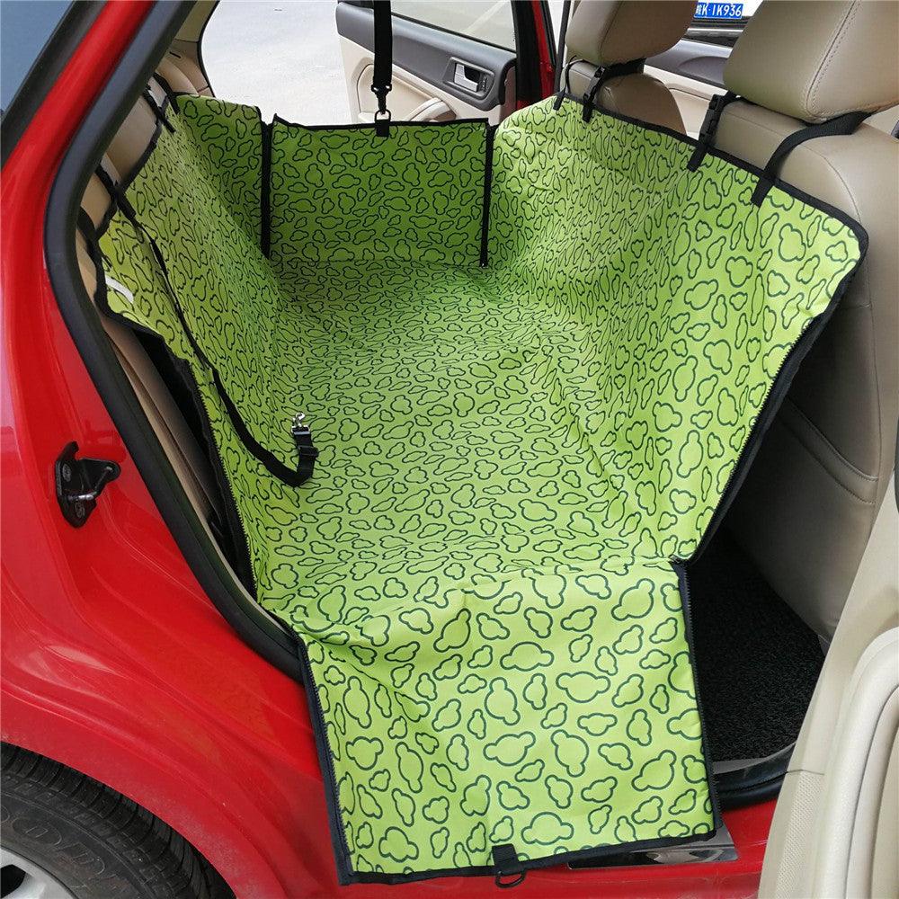 Happy dog enjoying the ride in a car with PetSafe Hammock Seat Cover