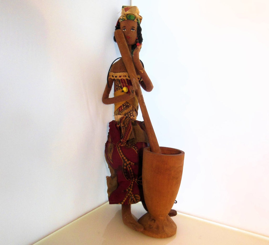 Close-up of the painted face of African Mother & Child Doll