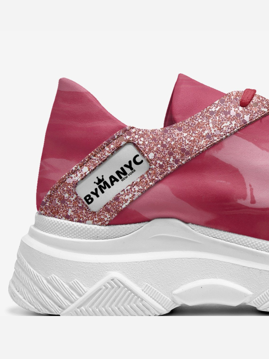 Model wearing Broadway Step eco sneakers on a city street by BYMANYC