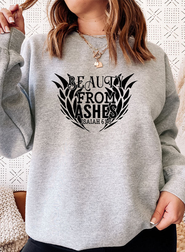 Model wearing Beauty From Ashes Isaiah Sweatshirt in a cozy setting