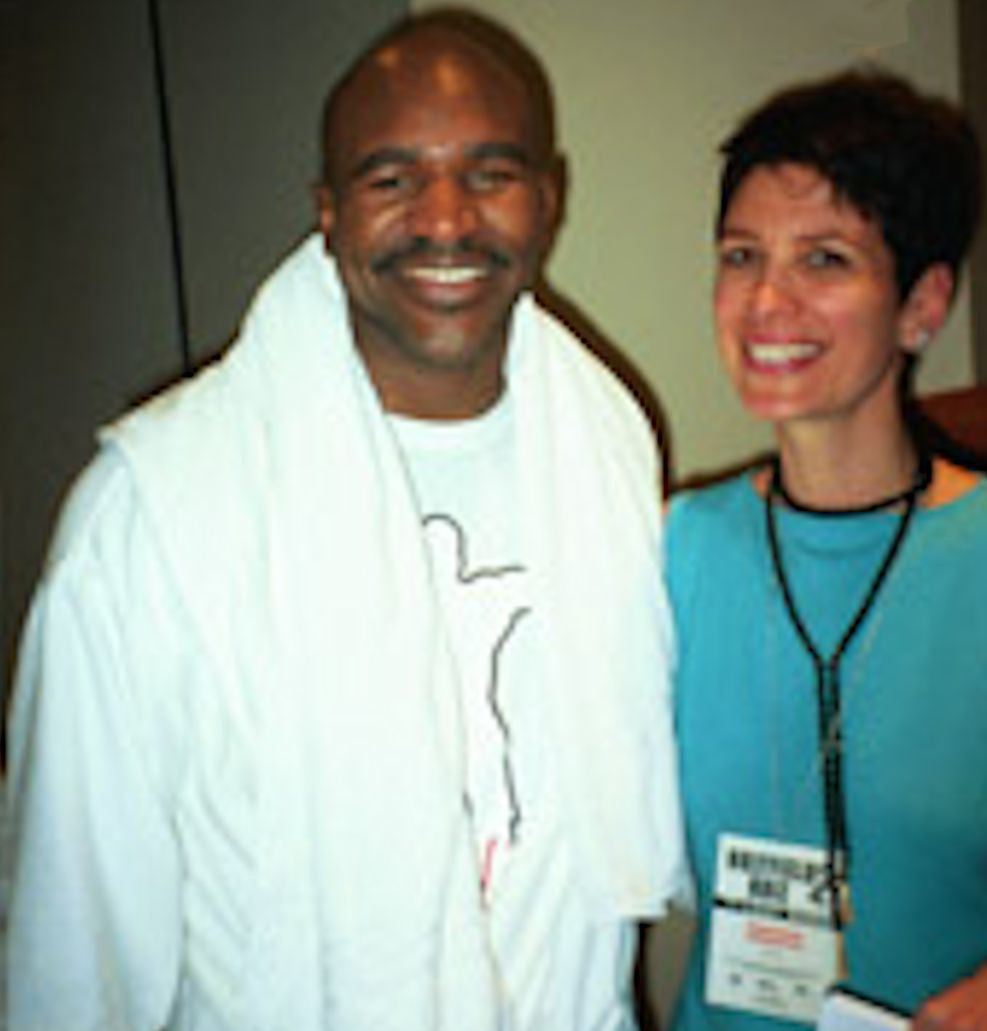 18K Gold Boxing Glove Key Ring displayed with other jewelry pieces