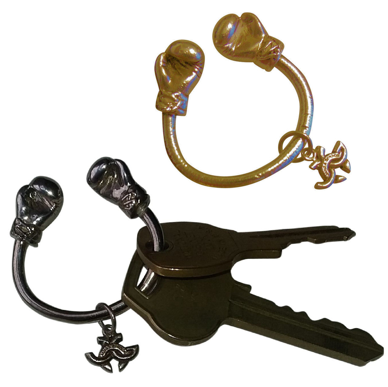 18K Gold Boxing Glove Key Ring with a blurred background