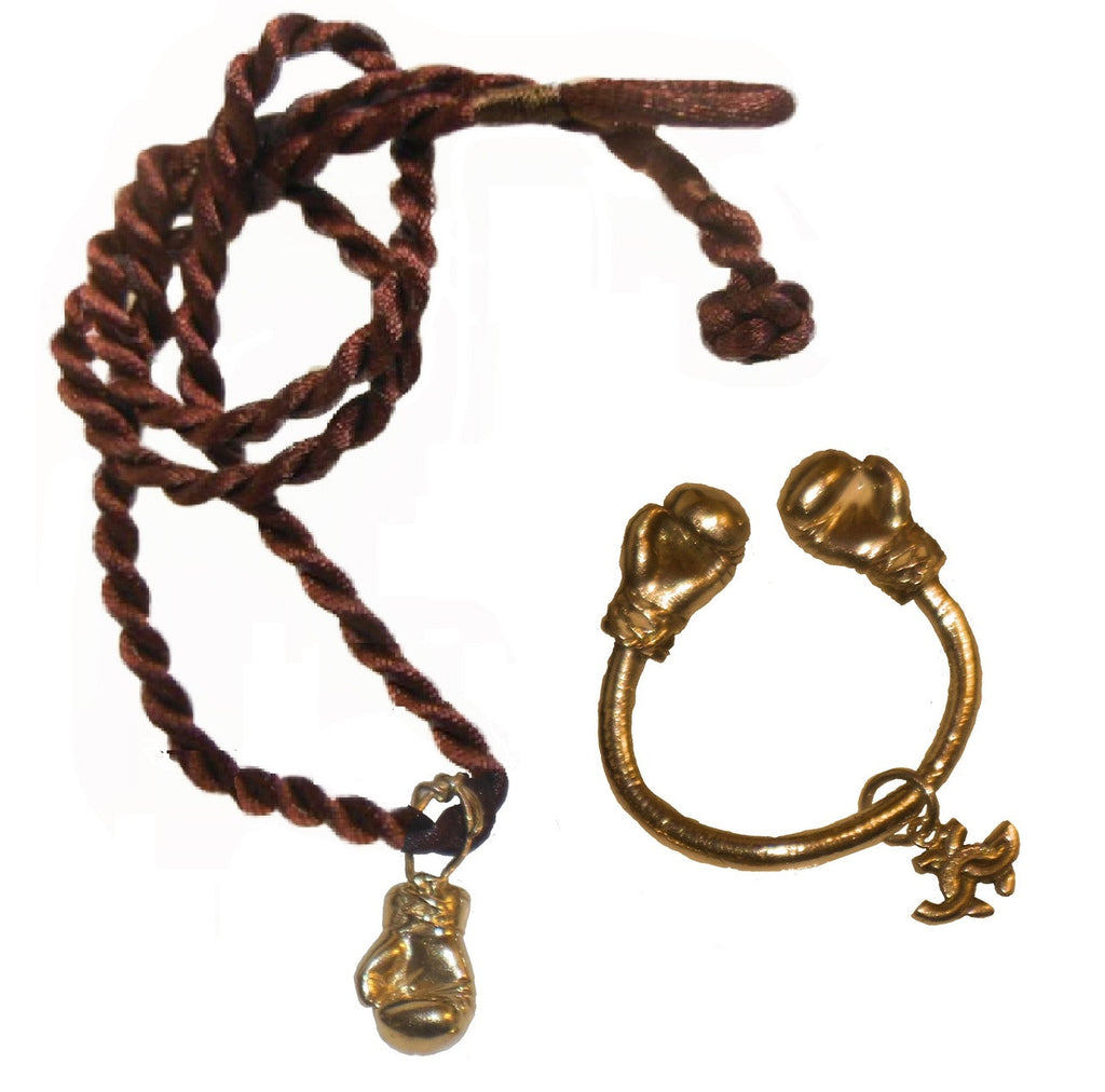 18K Gold Boxing Glove Key Ring resting on a wooden table