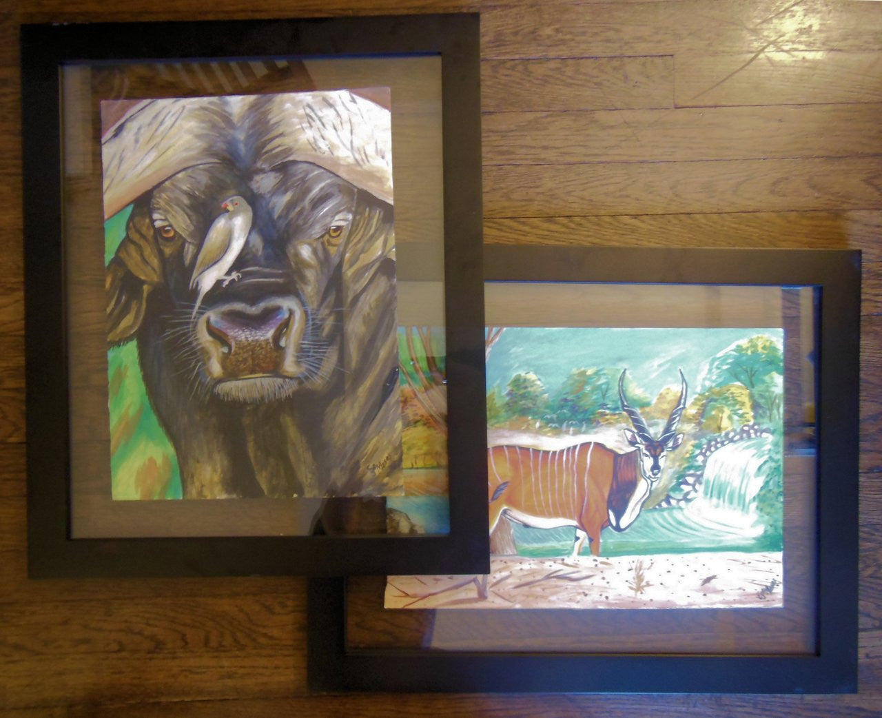 Elegant frame of Buffalo and Oxpecker artwork on display