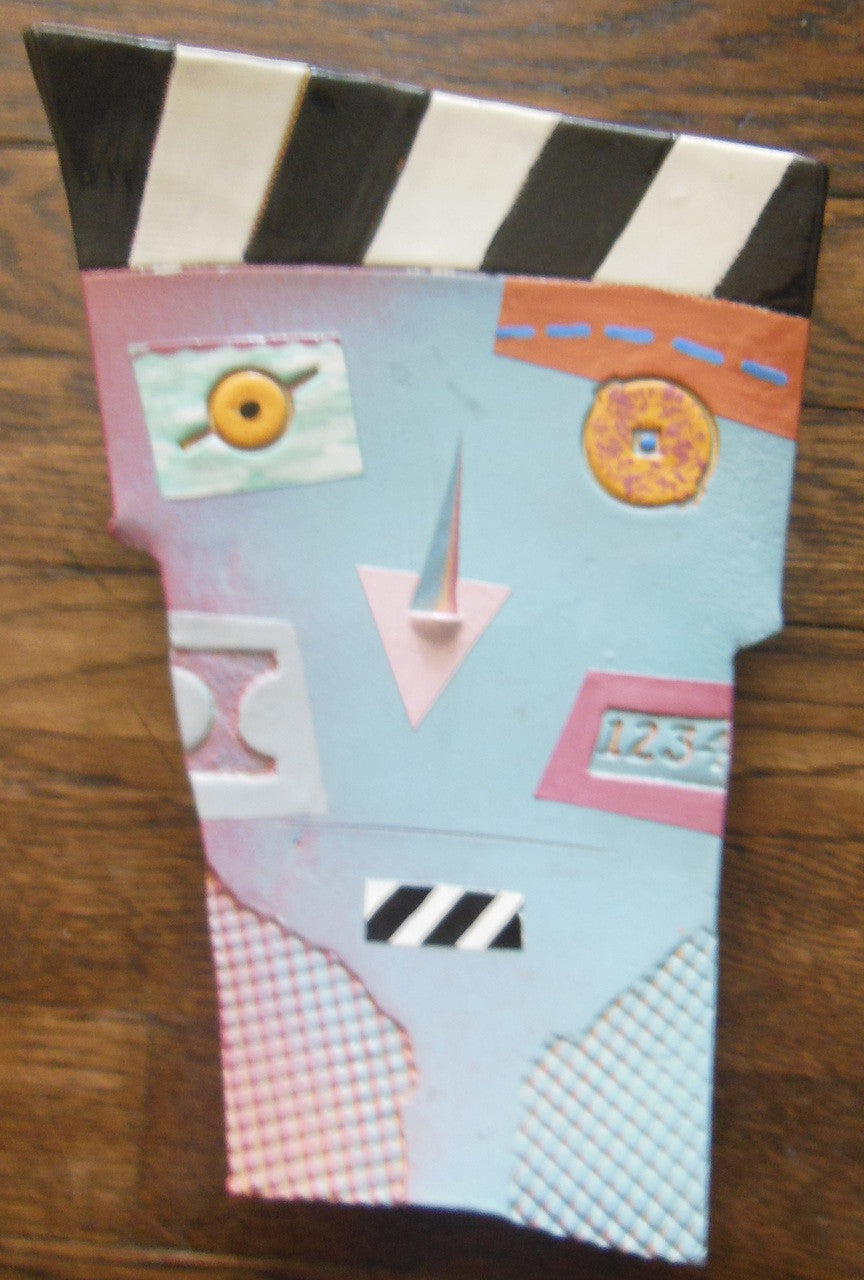 Close-up of the soft pastel colors on the ceramic wall mask