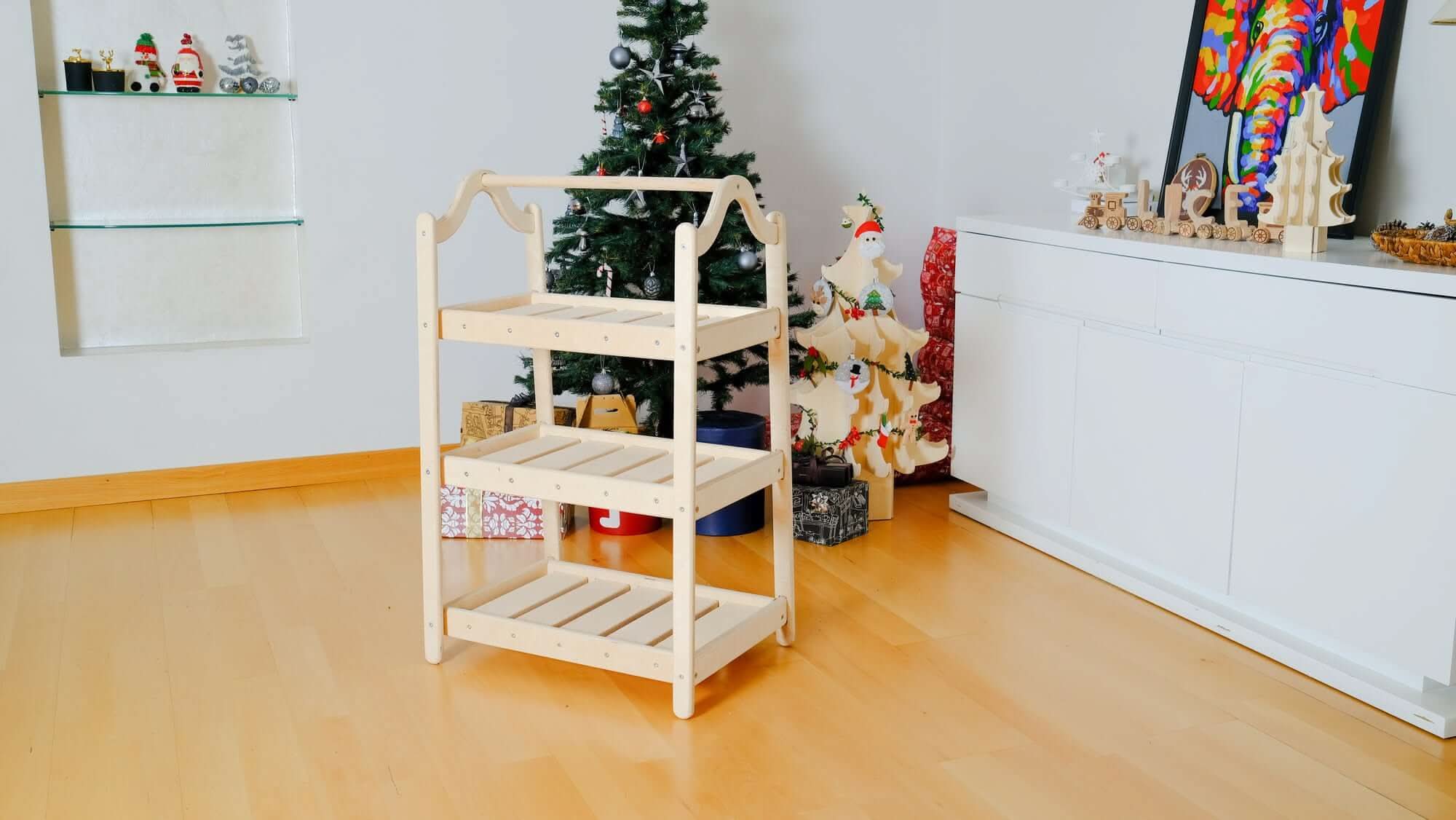 Close-up of adjustable hanging rack on Montessori Wooden Wardrobe Set