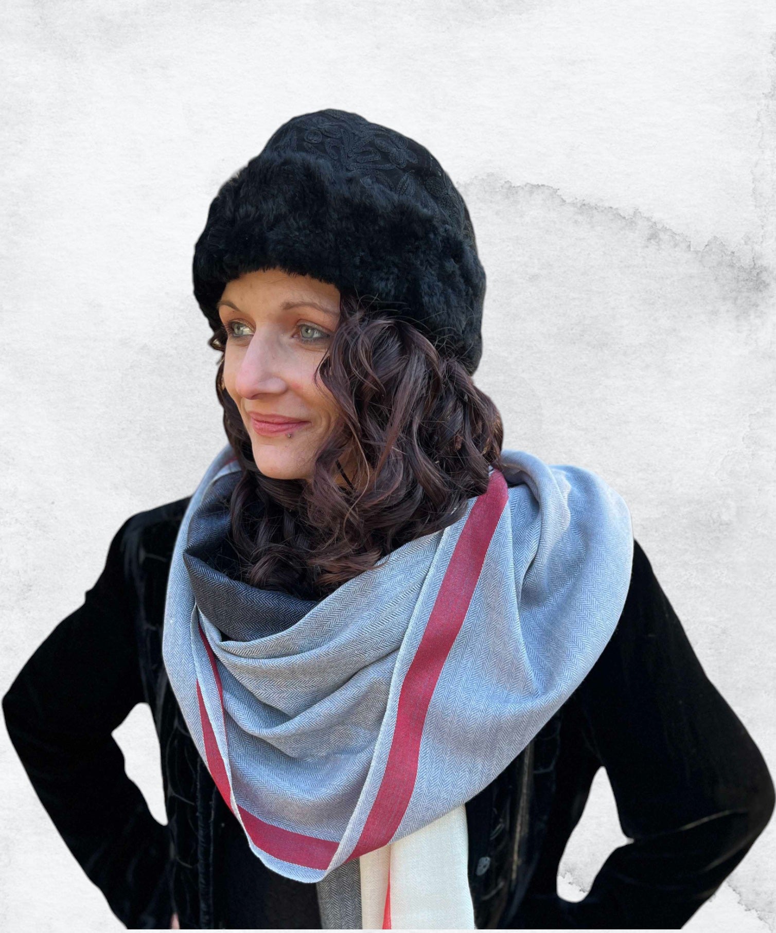 Close-up of handcrafted embroidery on black suede hat by Gobingya