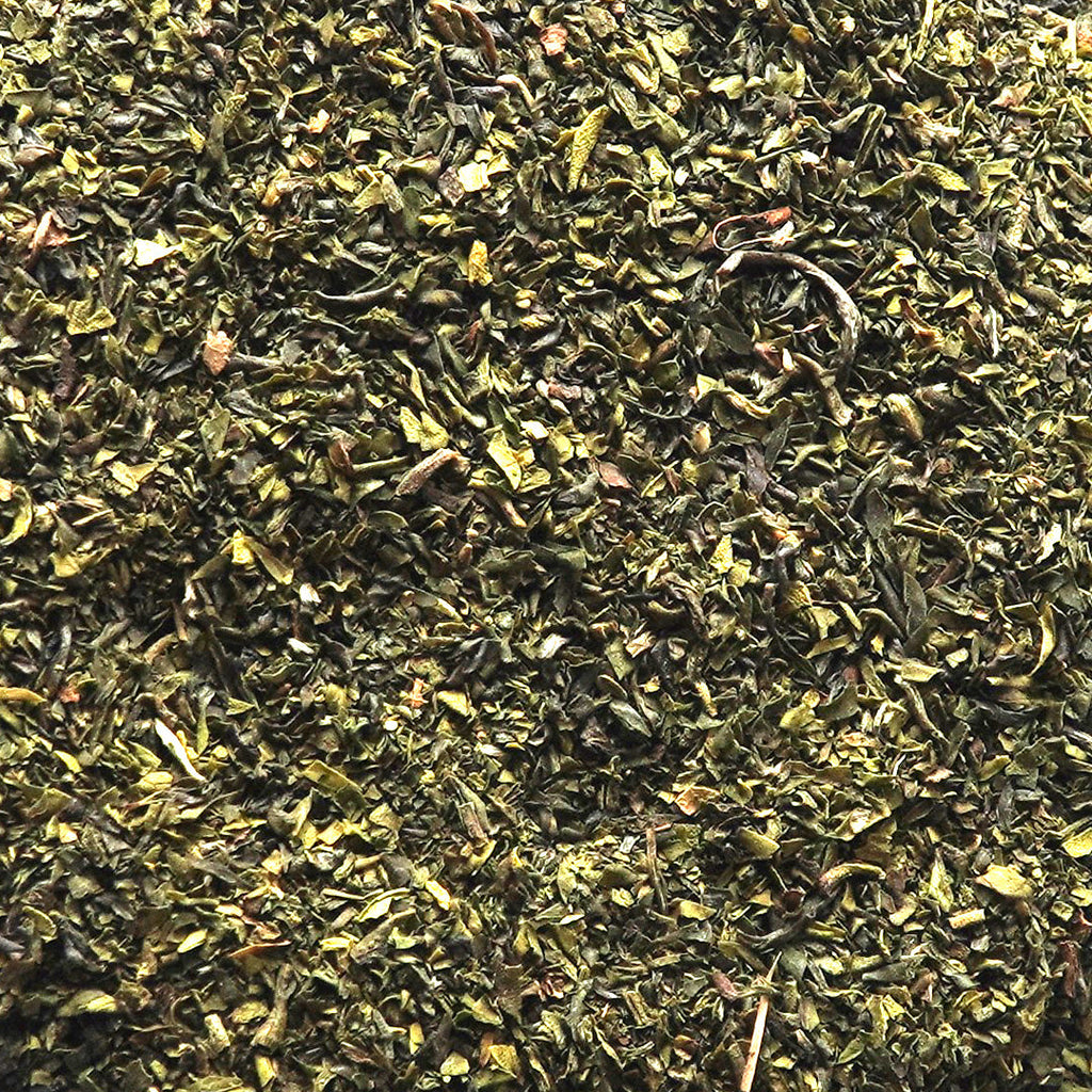 Close-up of Premium Organic Green Tea Fannings showcasing the rich texture and quality