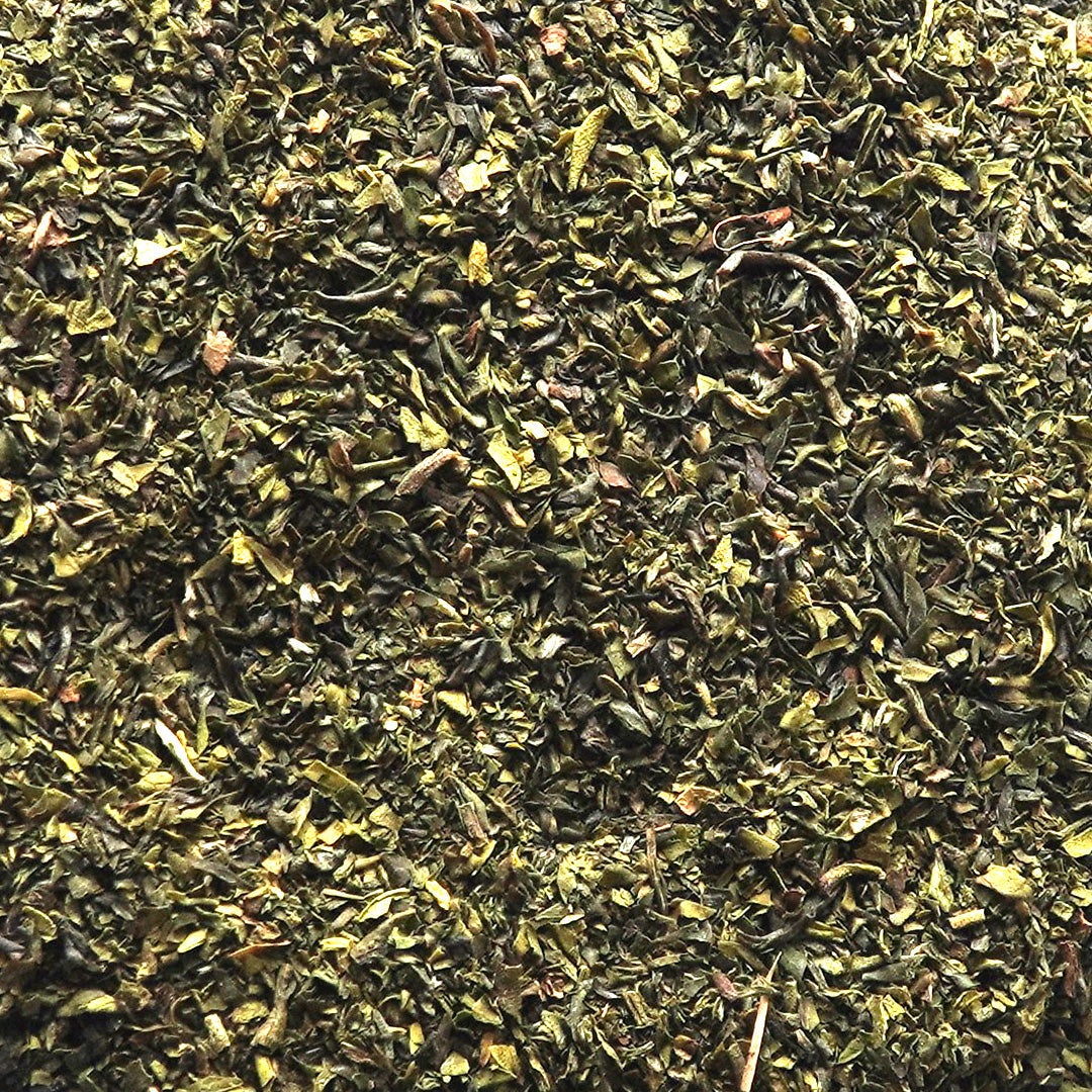 Close-up of Premium Organic Green Tea Fannings showcasing the rich texture and quality