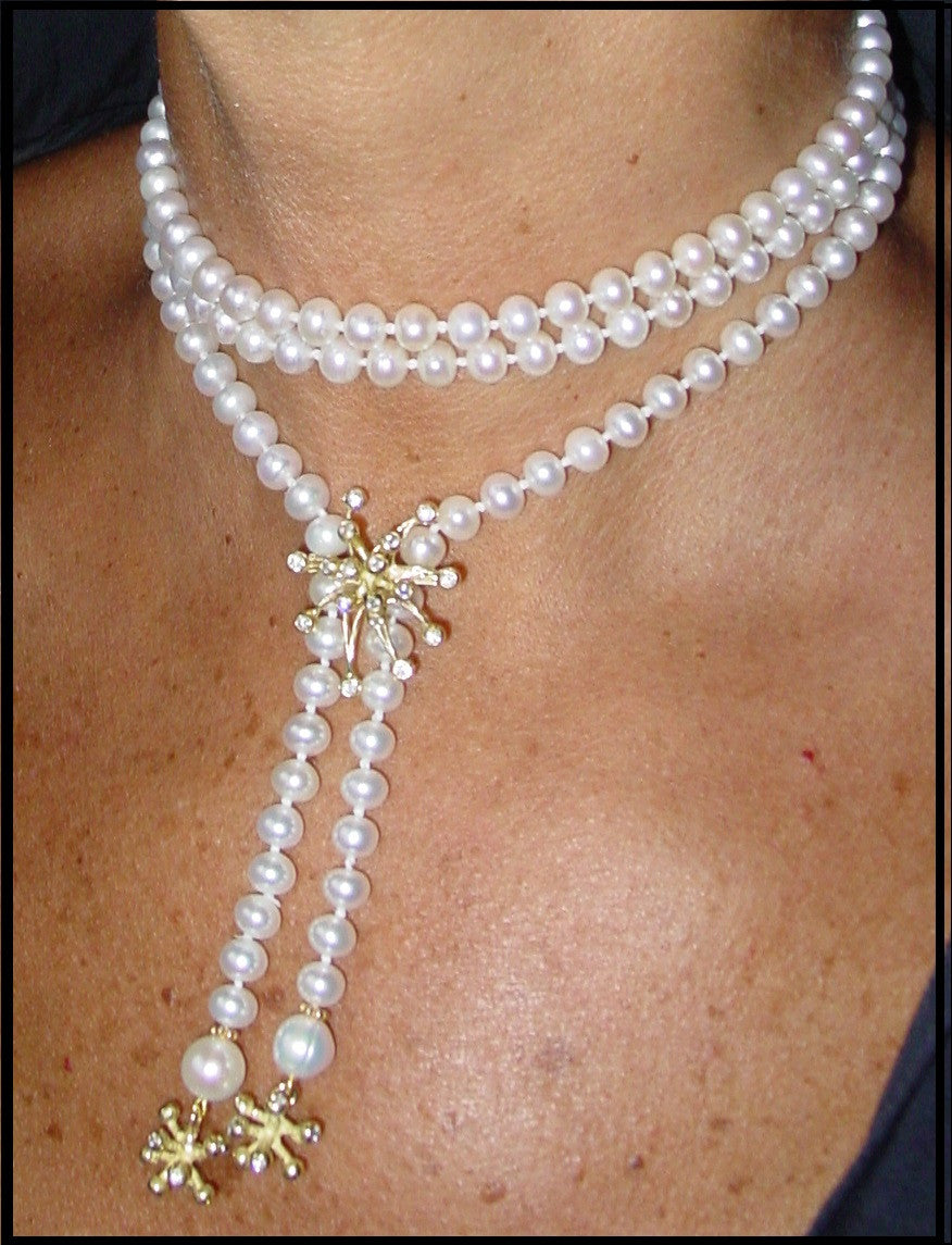 Side view of 18K Pearl Lariat Necklace highlighting its unique design