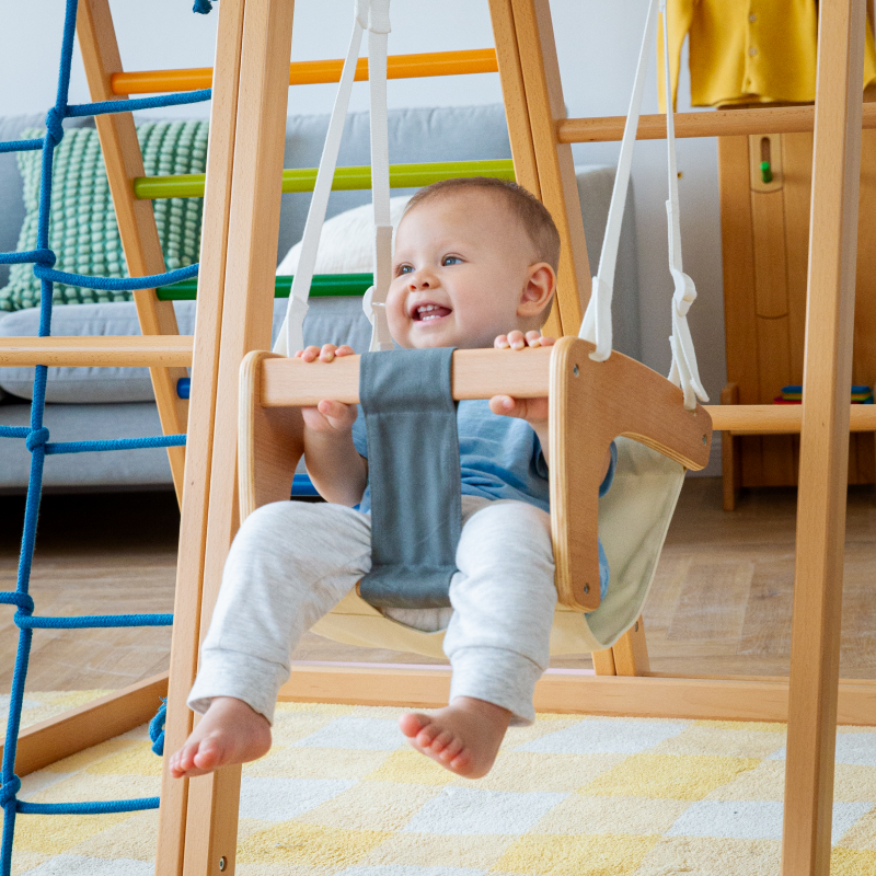 Side view of AVDAR GYM Baby Swing showcasing safety features