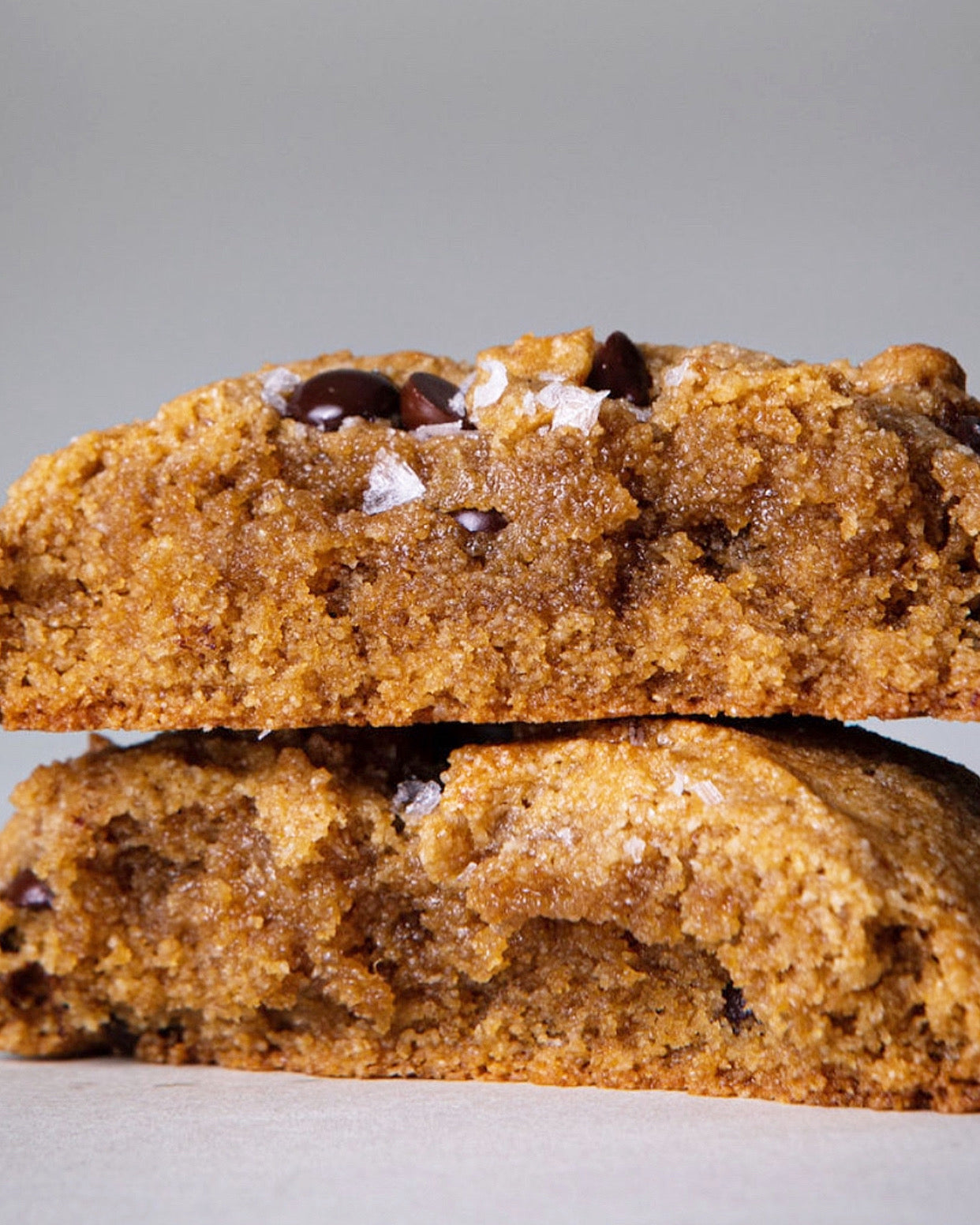 Assorted gluten-free chocolate chip cookies by Sweet Addison's displayed on a table