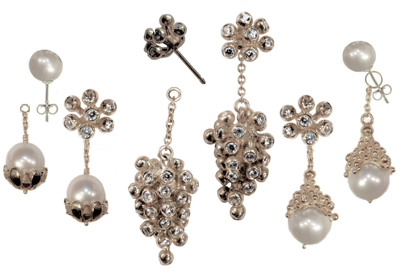 18K Gold Grape Drop Earrings hanging from jewelry stand