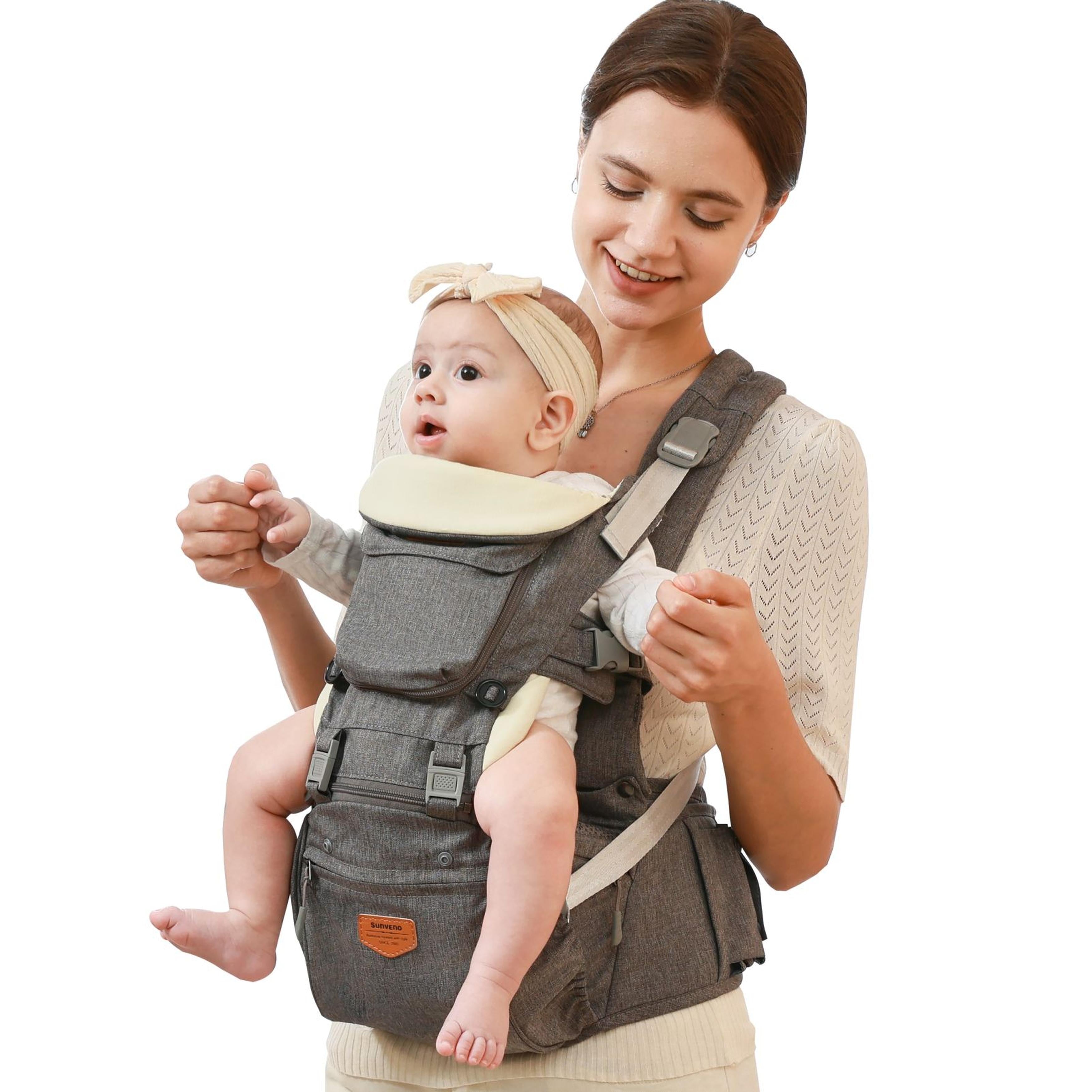 Family using SUNVENO Ergonomic Baby Carrier during a park stroll
