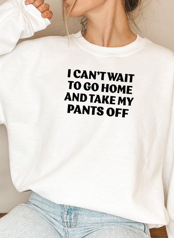 Model wearing 'I Can't Wait To Go Home' Sweatshirt in a cozy setting