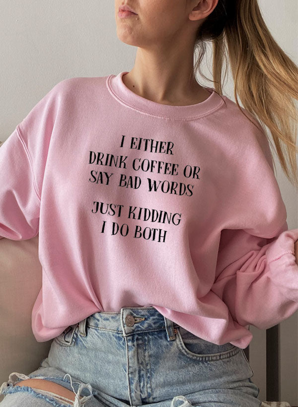 Lifestyle shot of I Either Drink Coffee Or I Say Bad Words Sweatshirt in casual setting