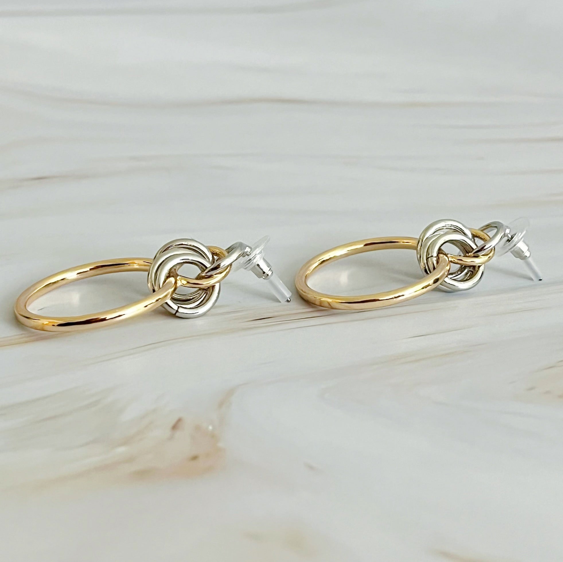 Model wearing Knock On The Beauty Hoop Earrings in stylish outfit