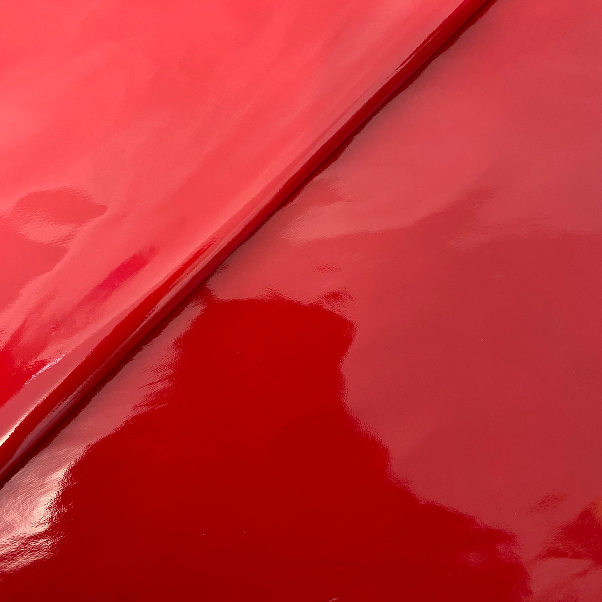 Close-up of Luxurious Faux Patent Leather Vinyl Fabric by Fashion Fabrics