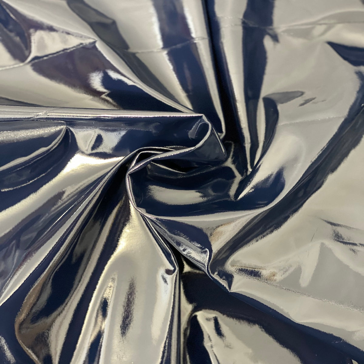 Luxurious Faux Patent Leather Vinyl Fabric rolled for easy storage