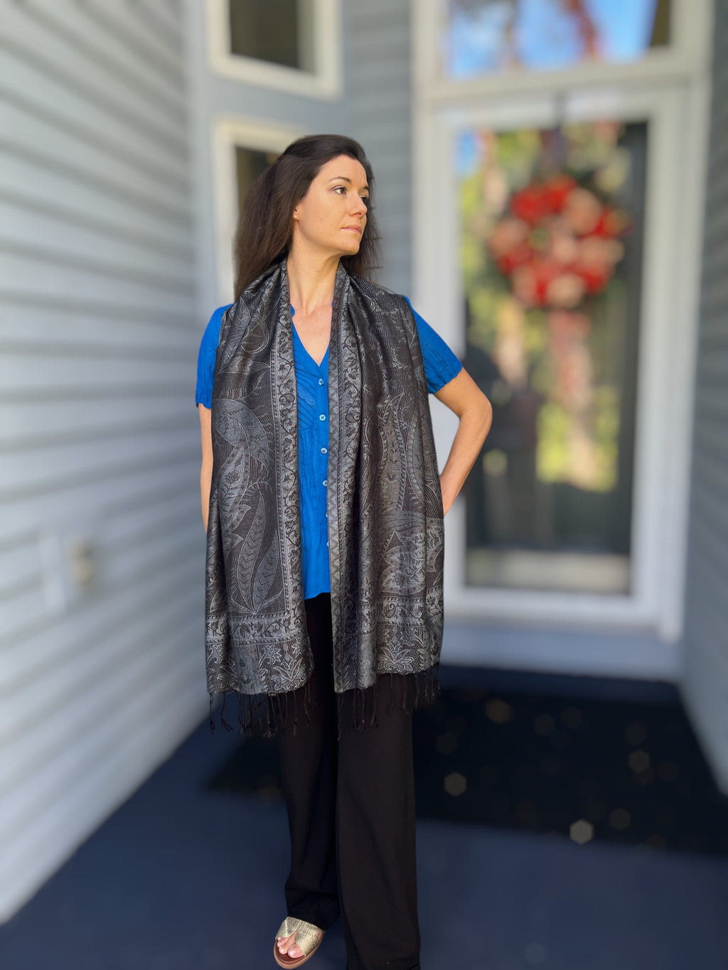 Flat lay of Black and Gray Modal Jamawar Pashmina Scarf with accessories