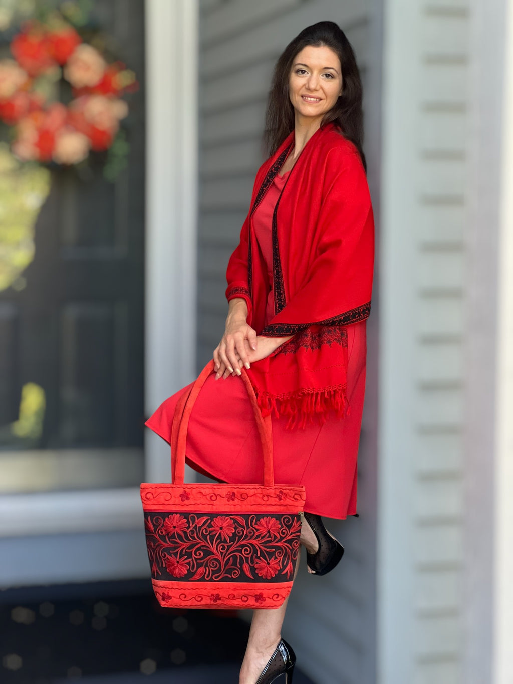 Lifestyle image of Artisan Red Suede Tote Bag in urban setting