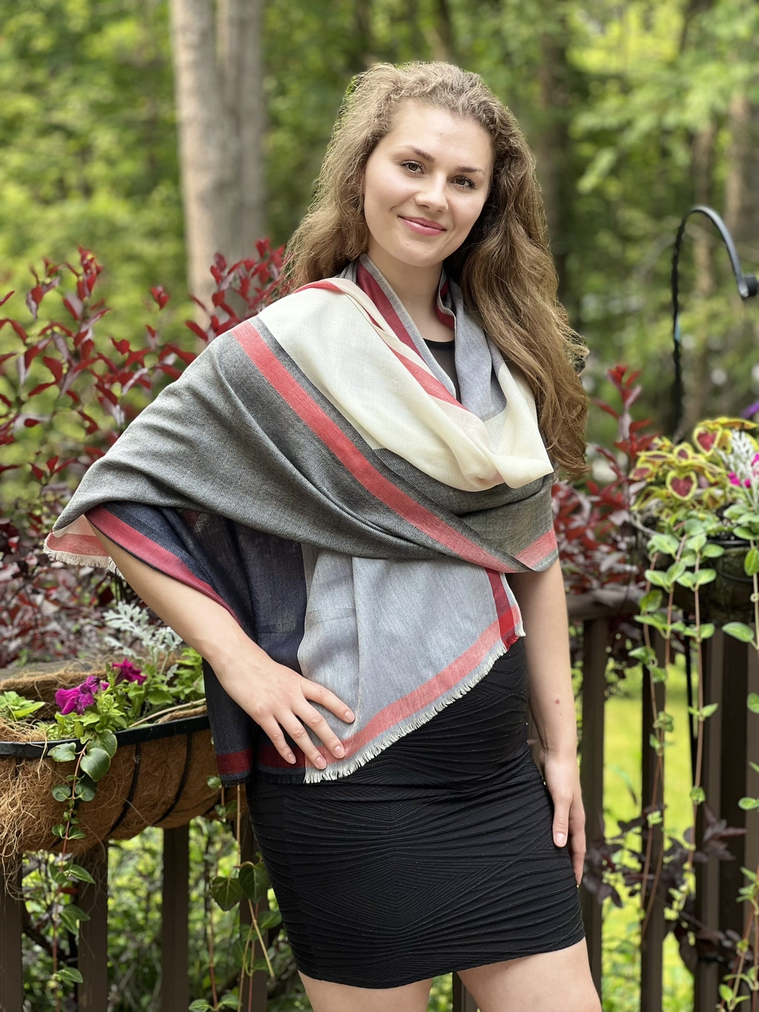 Model wearing Premium Black and White Plaid Wool & Silk Scarf outdoors