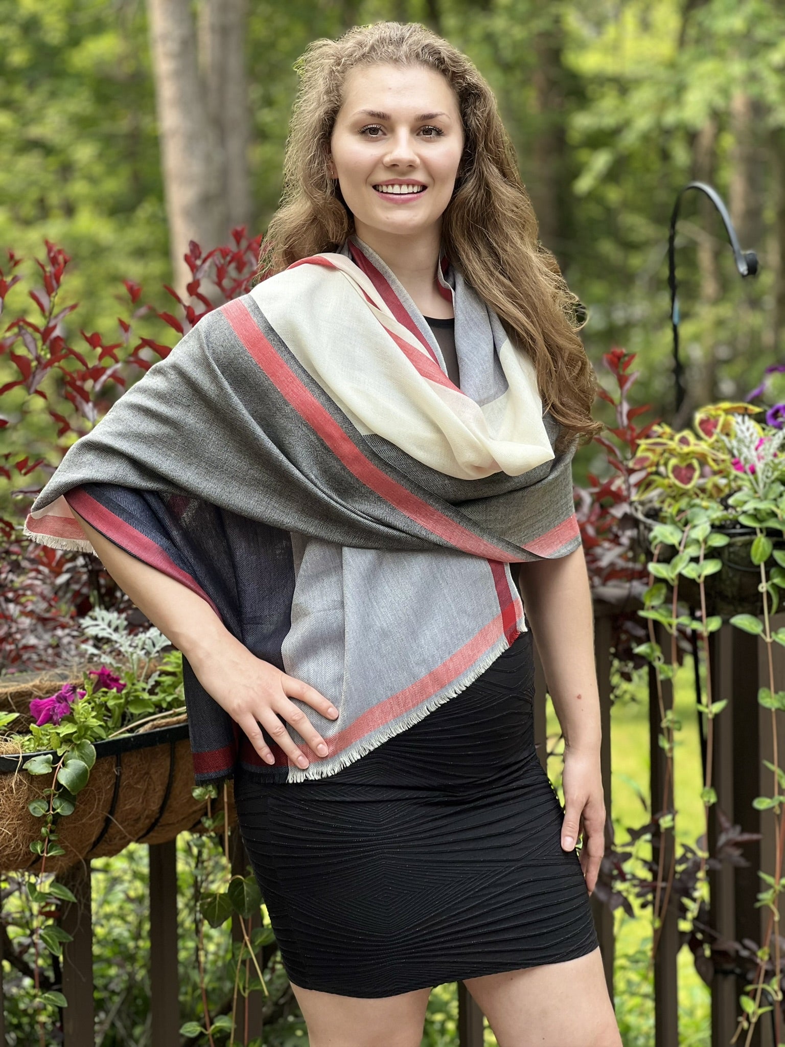 Flat lay of Black and White Plaid Wool & Silk Scarf on a cozy blanket
