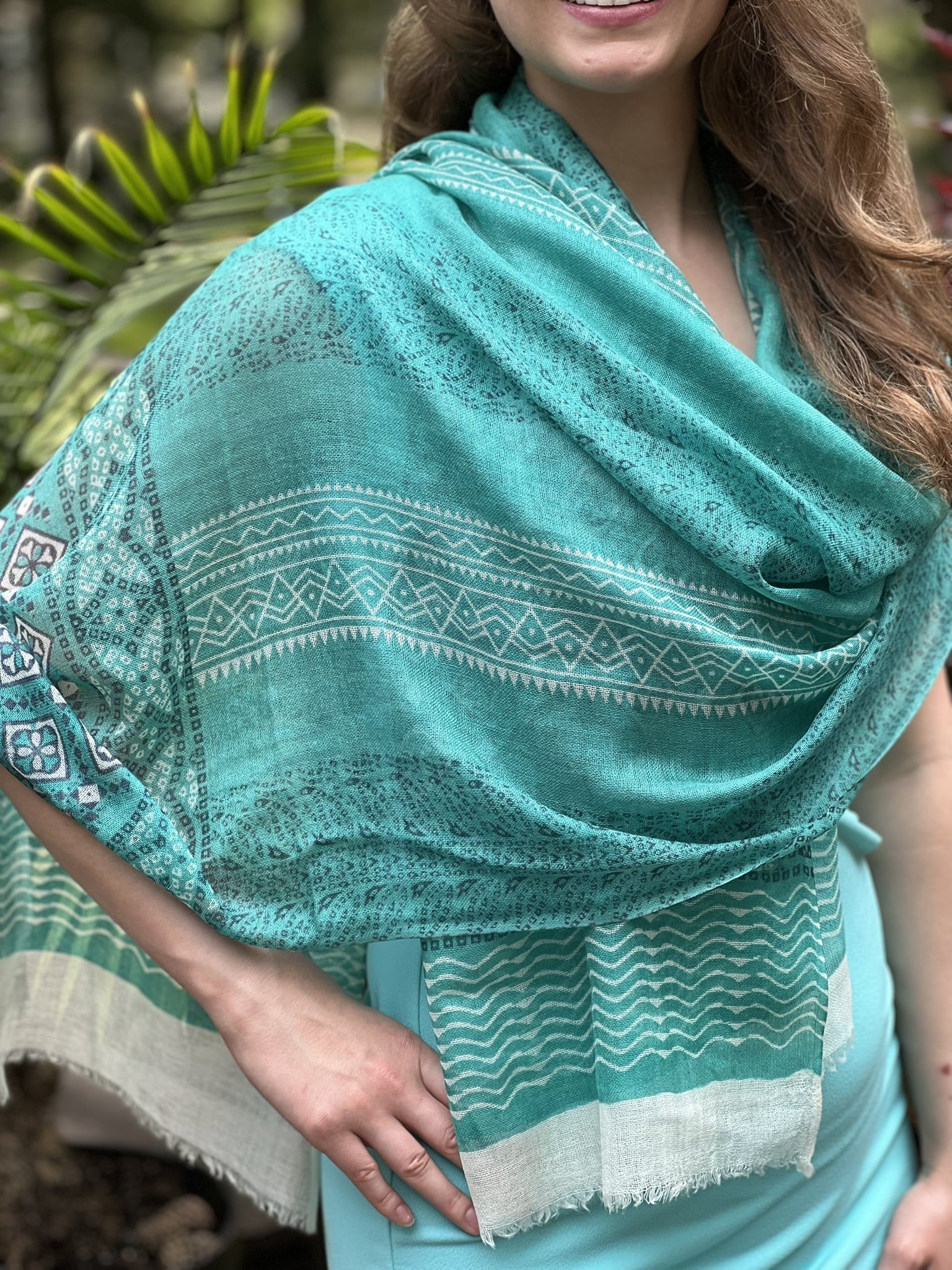 Luxurious Green Hand-Painted Wool & Silk Blend Scarf on a display stand