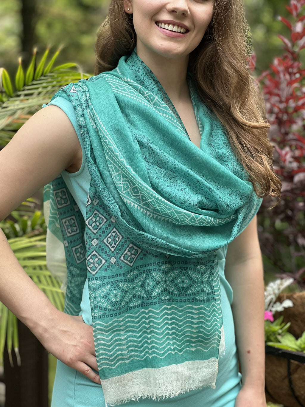 Close-up of the hand-painted design on Luxurious Green Scarf by Gobingya