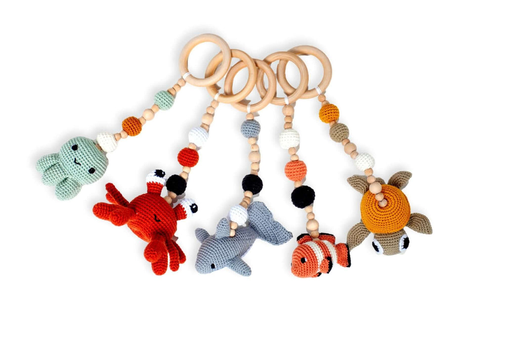 Front view of Montessori Baby Play Gym with crochet toys by Kidodido