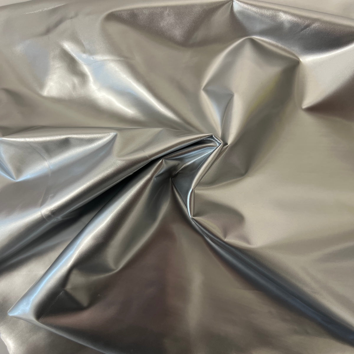 Luxurious Faux Patent Leather Vinyl Fabric draped elegantly
