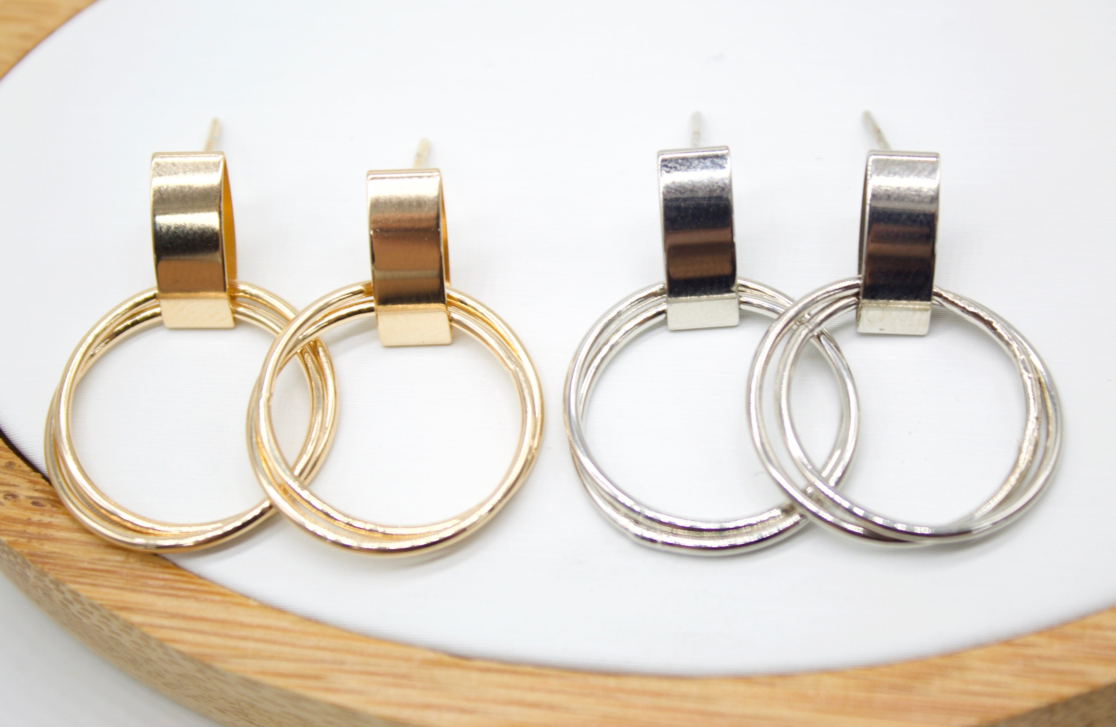 Close-up view of MIA's 18K Gold Earrings highlighting their luxurious shine