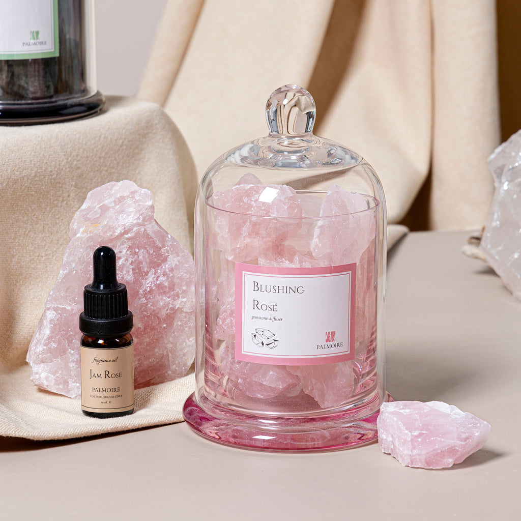 Blushing Rosé Gemstone Diffuser with Jam Rose fragrance oil beside it