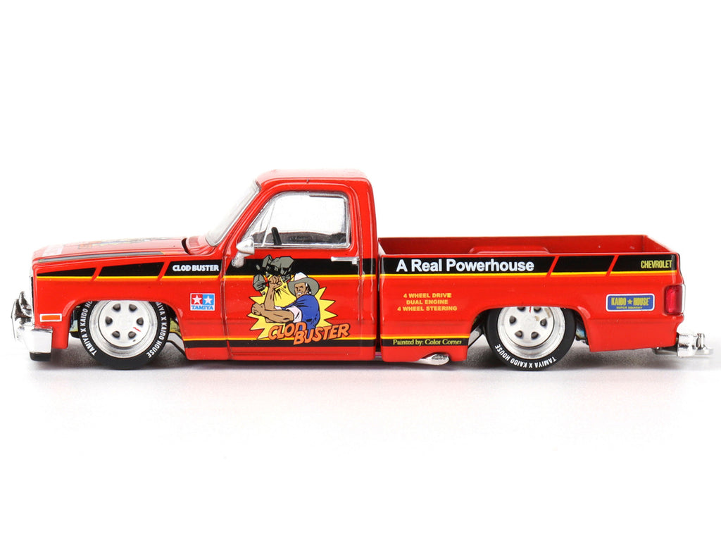 Front view of Chevrolet Silverado Clod Buster diecast model in orange by Mini GT