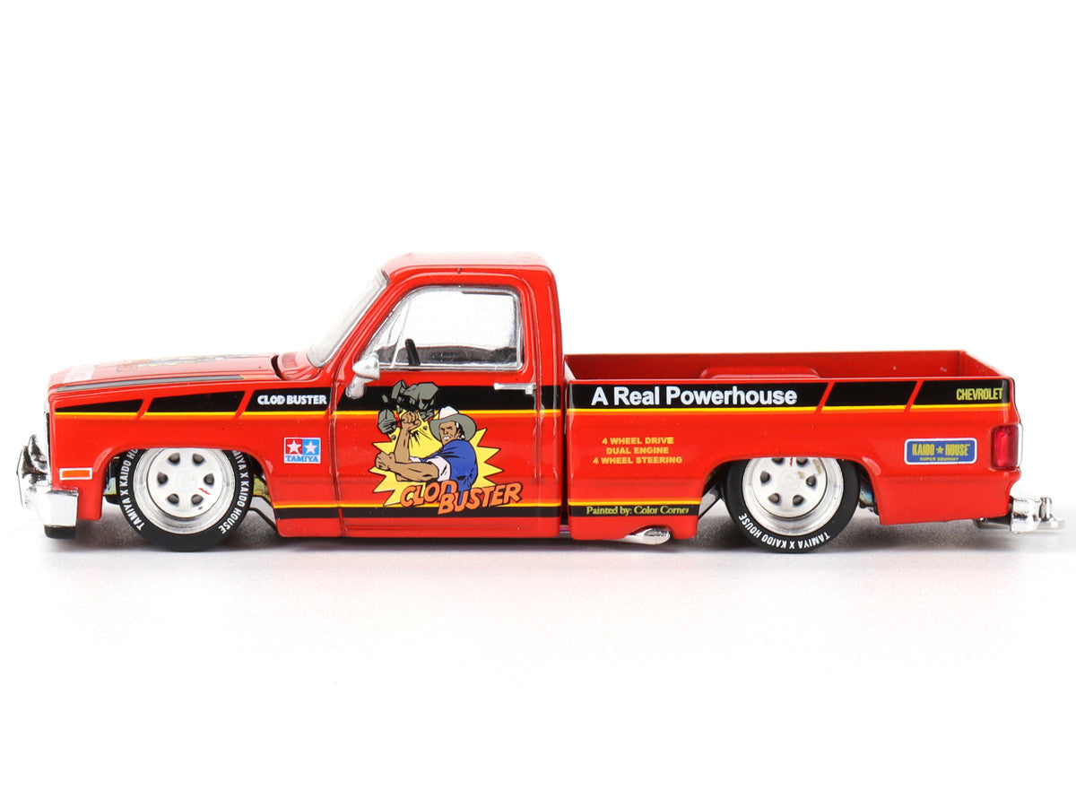 Front view of Chevrolet Silverado Clod Buster diecast model in orange by Mini GT
