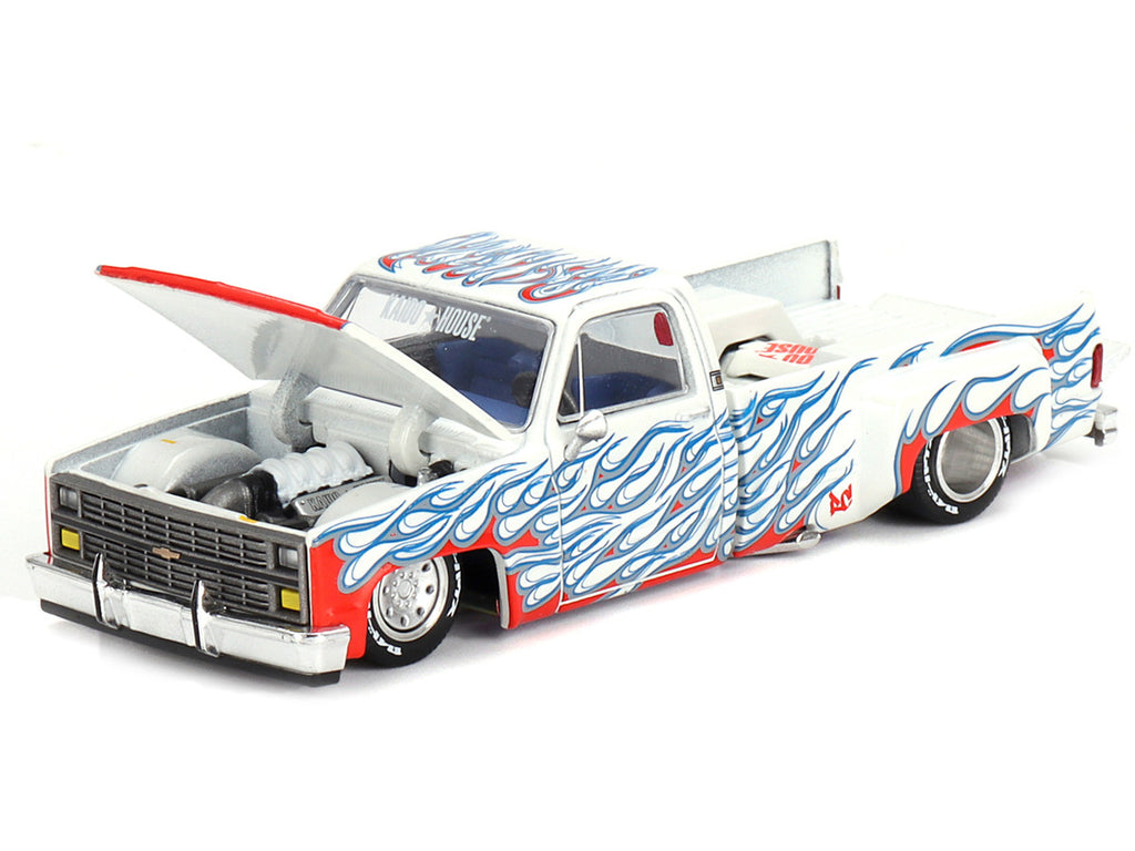 Side angle of Exclusive Chevrolet Silverado Dually Pickup Truck Diecast Model in white metallic