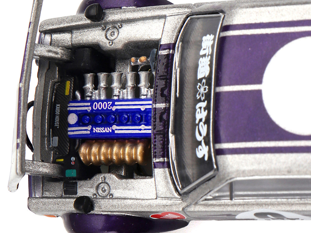 Side profile of Nissan Skyline 2000GT-R diecast model with Purple Stripes