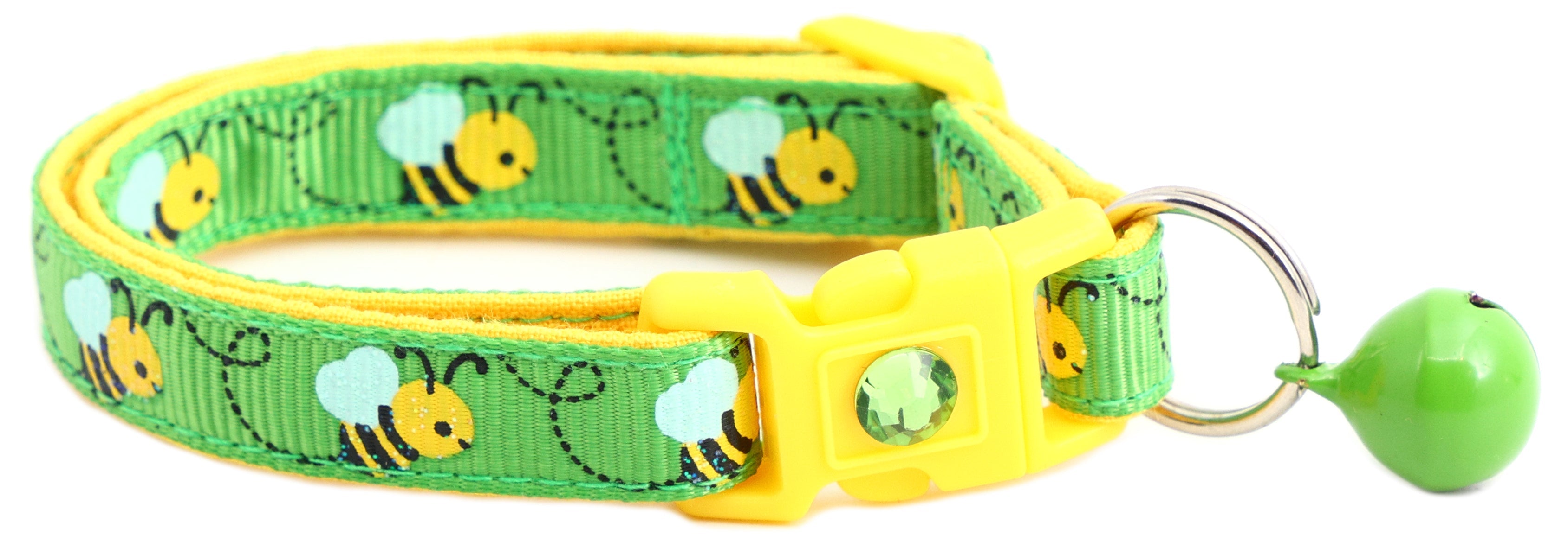 Handmade Honey Bees Cat Collar lying next to catnip toys