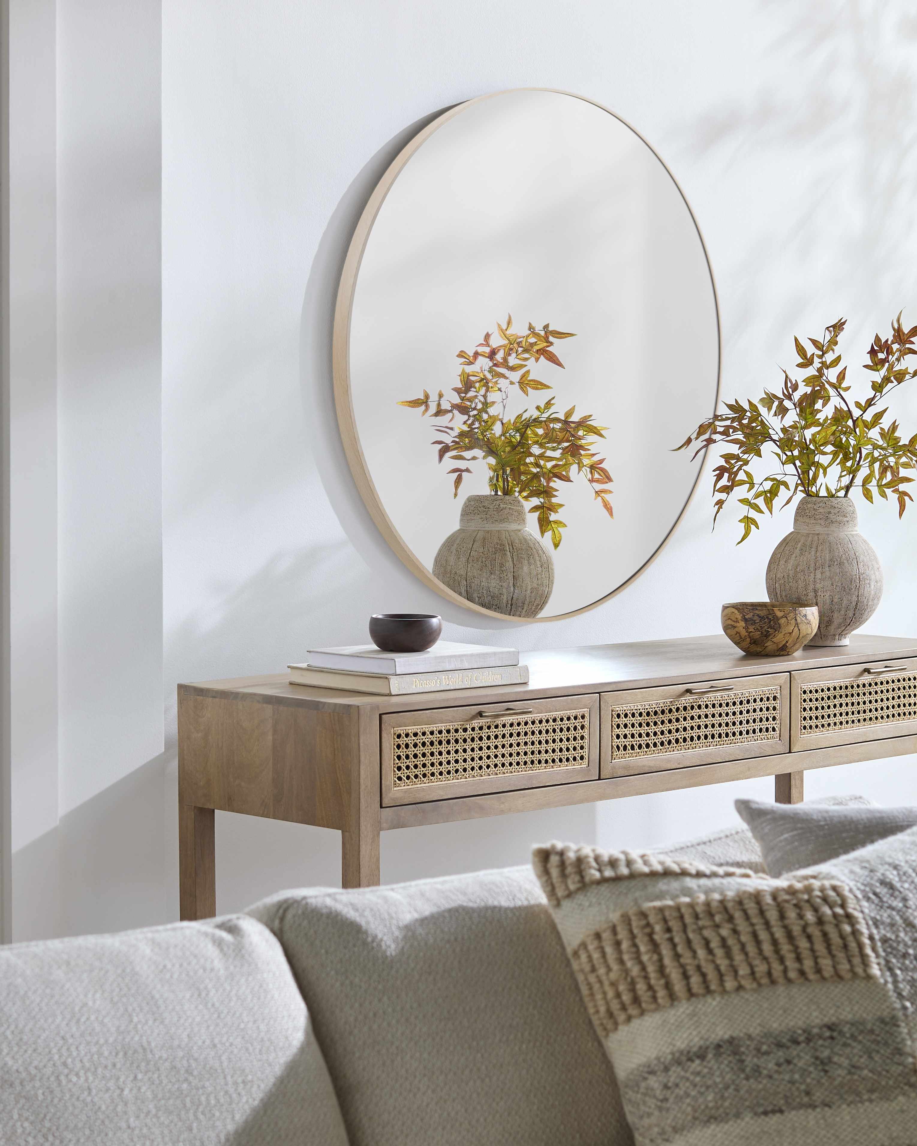 Side angle of Pontalina Dark Red Mirror showcasing aluminum frame