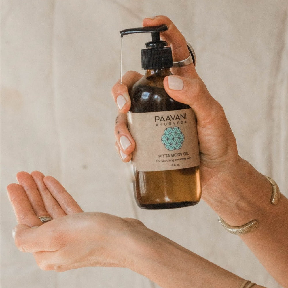 Cooling Pitta Body Oil application on skin demonstrating hydration