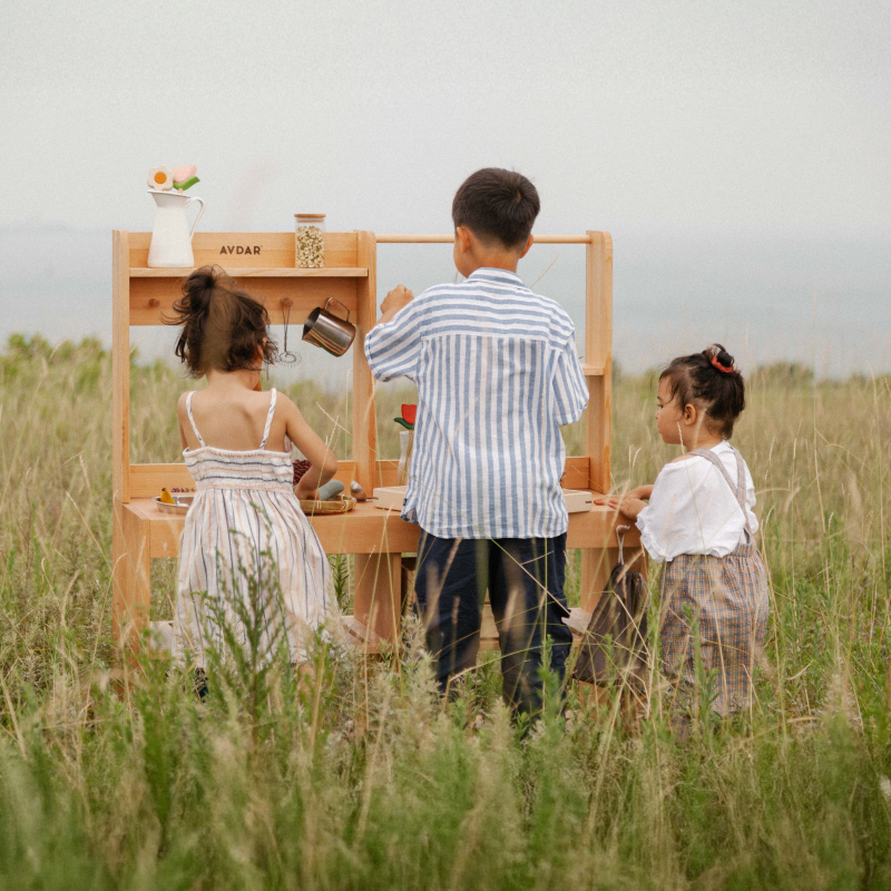 Kids enjoying creative play with AVDAR Mud Kitchen 2.0