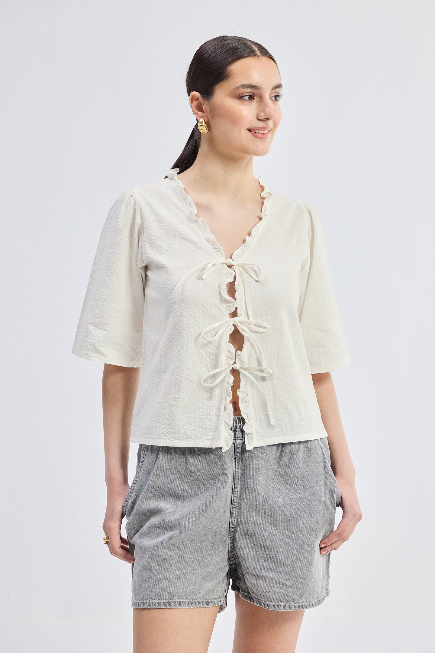 Relaxed Fit Top With Ruffles and Front-Ties in Cream