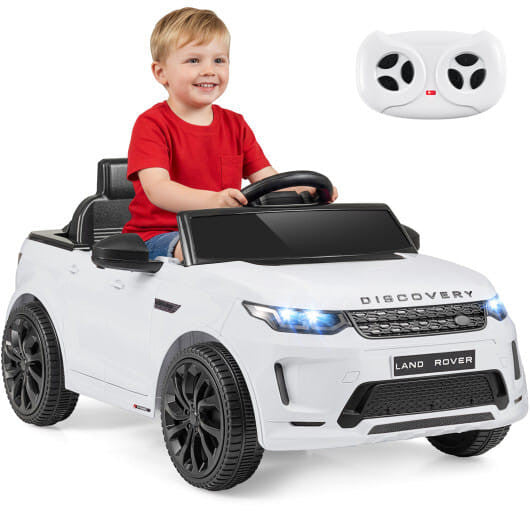Child enjoying the Gobingya Land Rover Kids Ride-On Car outdoors